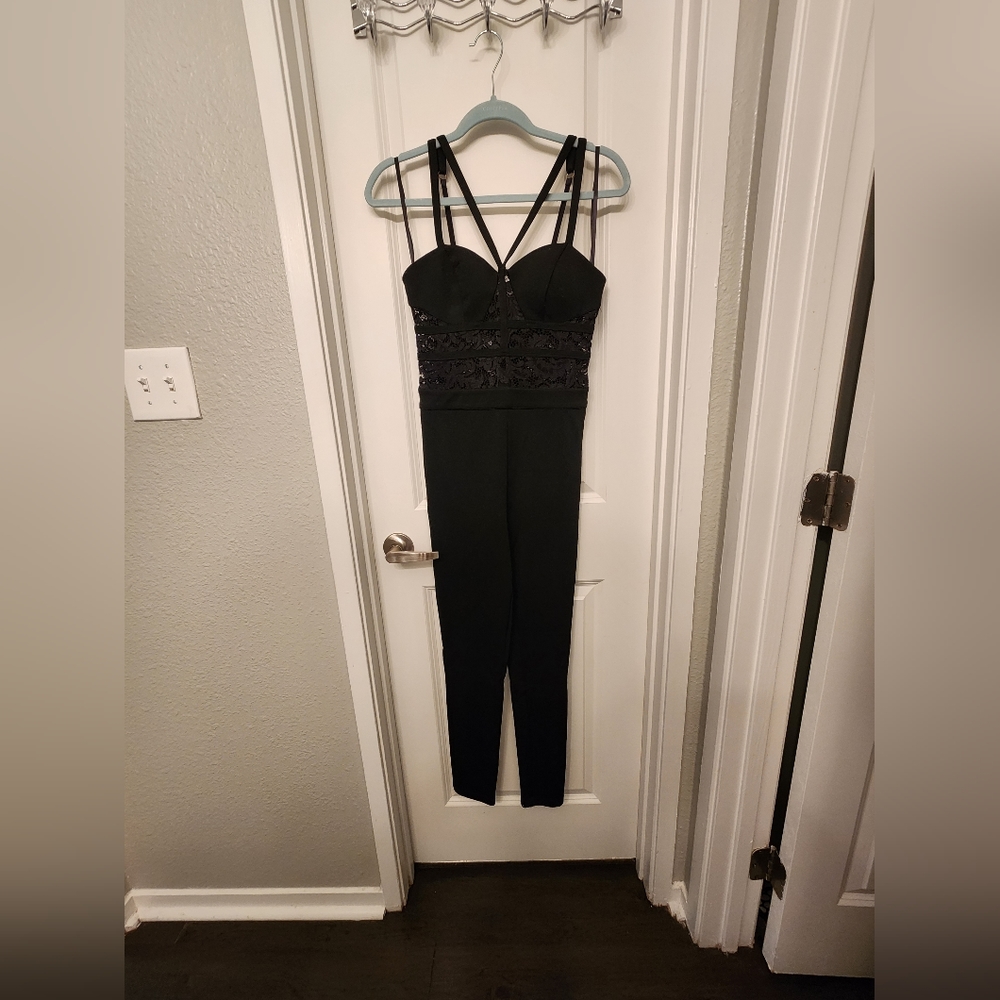 Black Bebe jumpsuit with lace inserts. Size XS